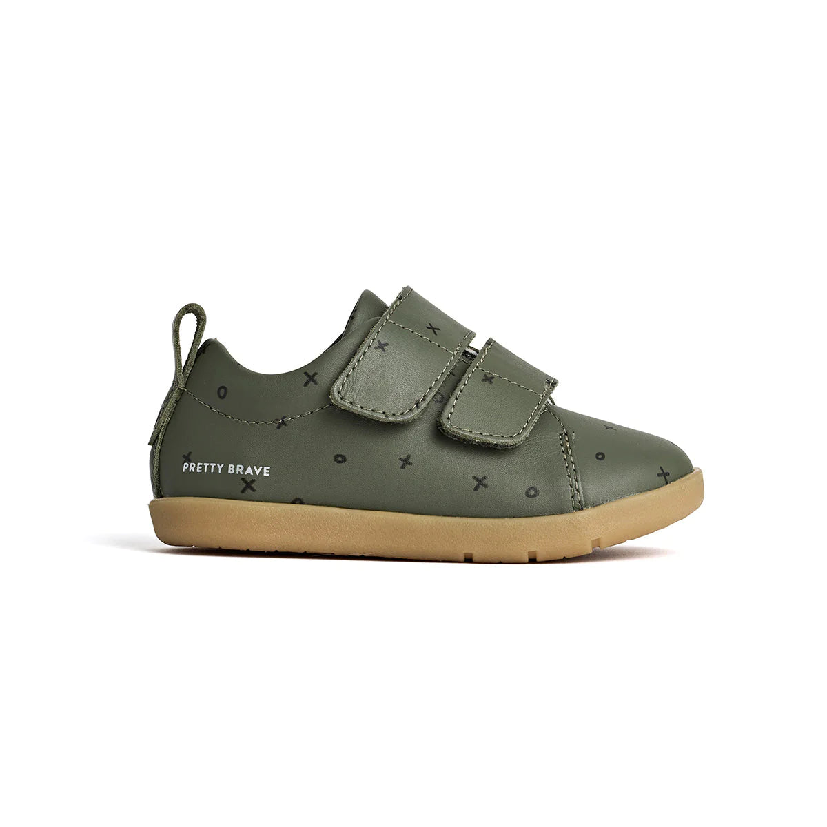 A single khaki green toddler shoe with x and o patterns, two velcro straps, and a brown sole.