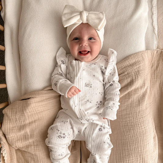 baby zip romper, delicate lilac flowers on white pointelle  organic cotton.